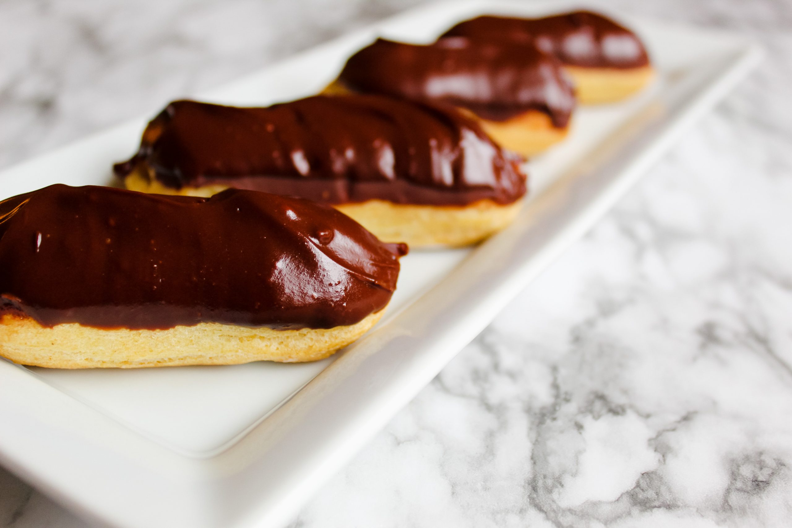 gluten free eclairs glazed in chocolate